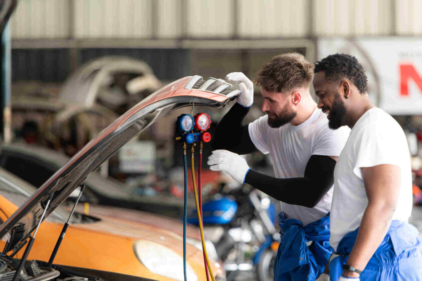 two mechanics working at an auto shop in philadelphia