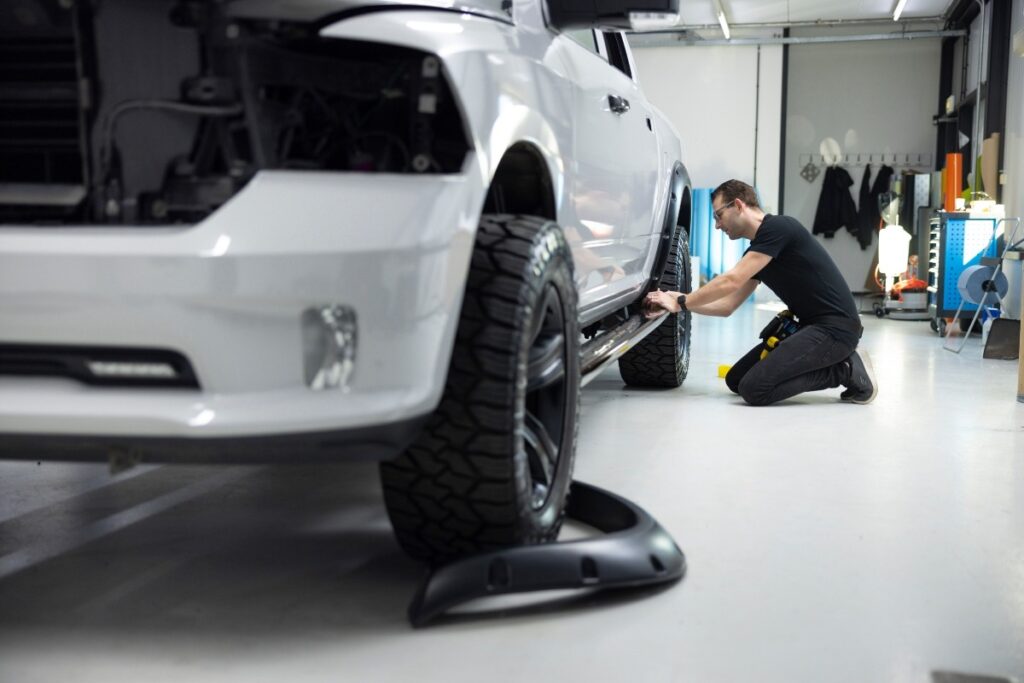 A technician working on a car